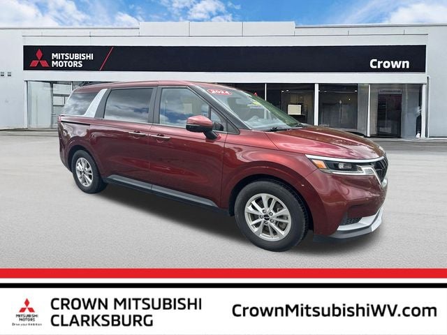 2024 Kia Carnival LX in Flare Red — front three-quarter view