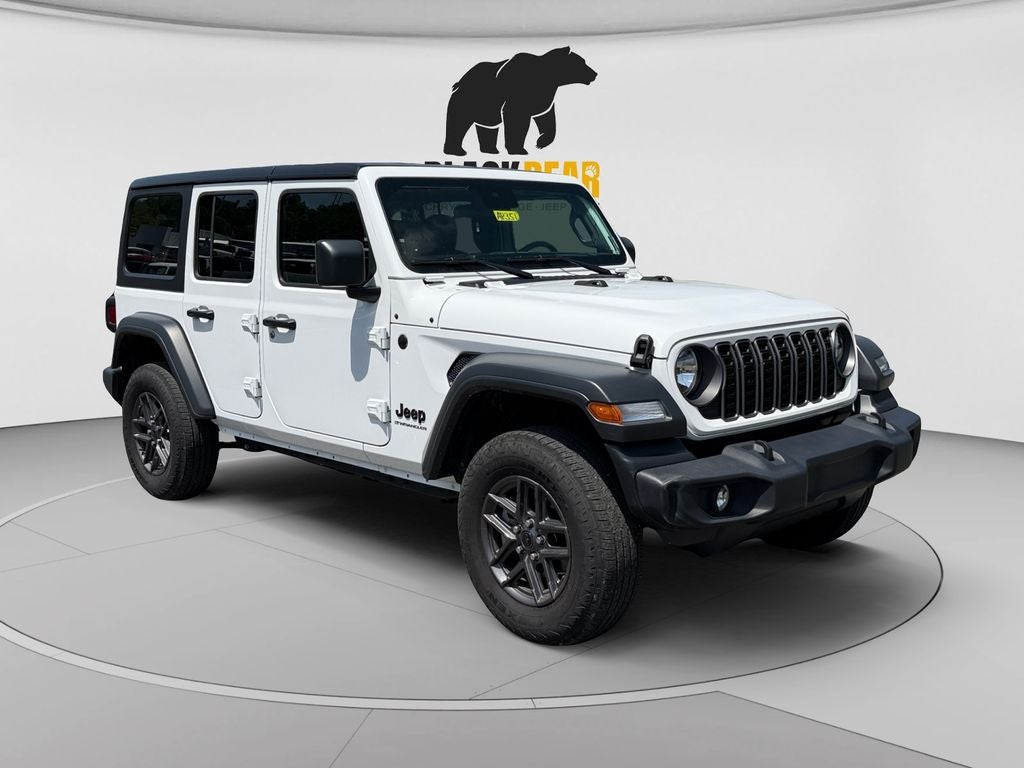 2025 Jeep Wrangler 4-Door Summit 4x4 in Bright White Clearcoat — front three-quarter view
