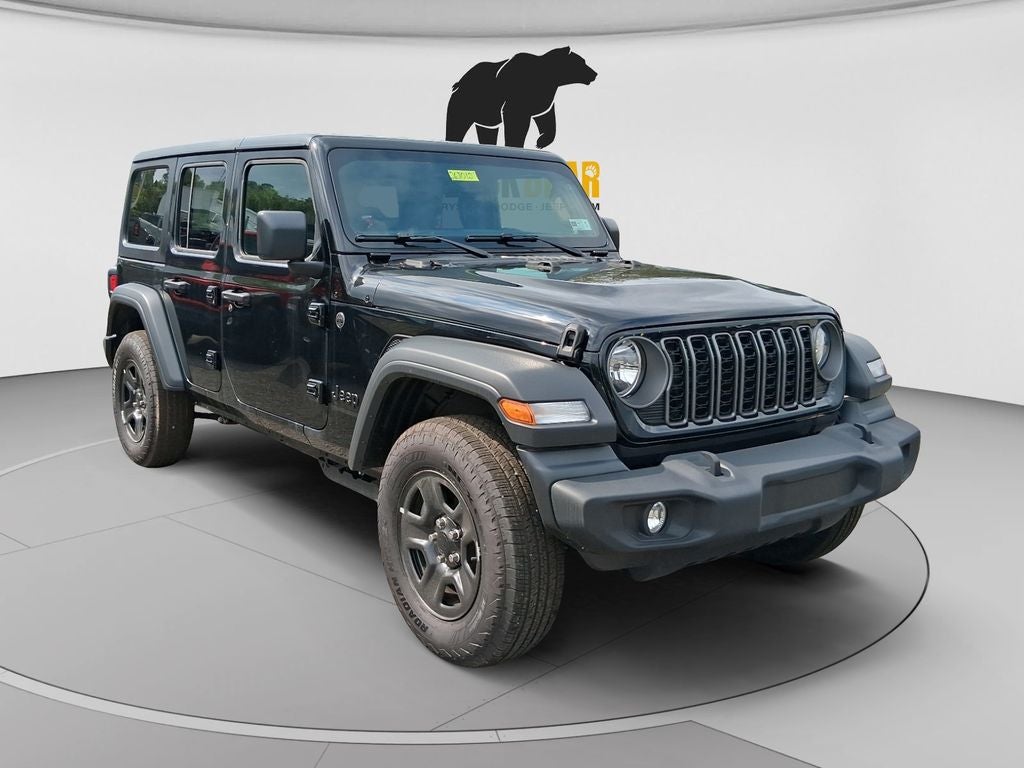 2026 Jeep Wrangler WRANGLER 4-DOOR SPORT in Black Clear-Coat Exterior Paint — front three-quarter view
