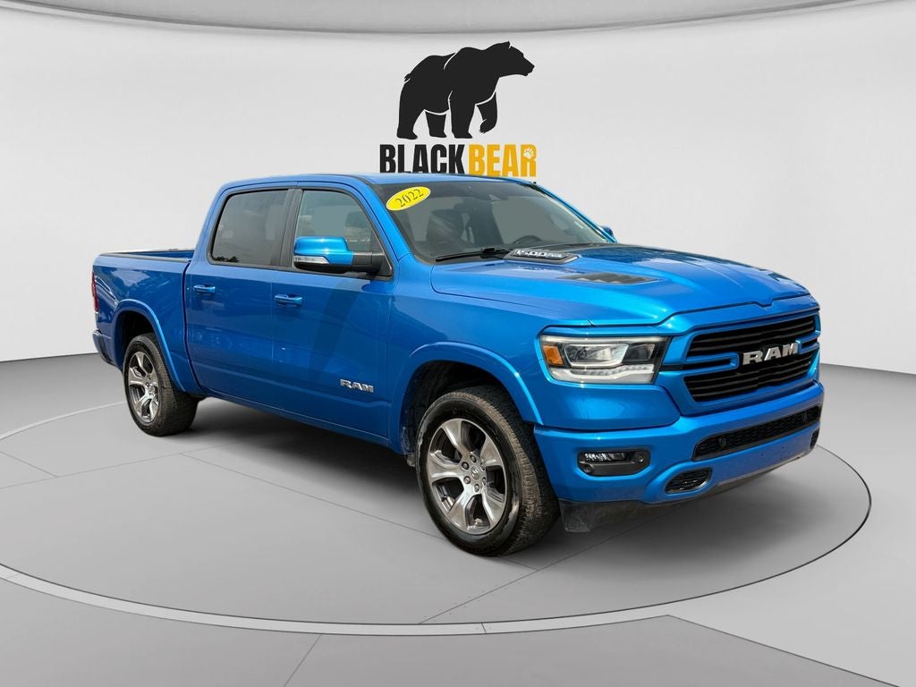 2022 RAM 1500 Laramie Crew Cab 4x4 5'7' Box in Hydro Blue Pearlcoat — front three-quarter view
